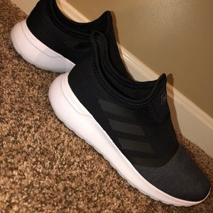 Black and charcoal grey adidas slip on